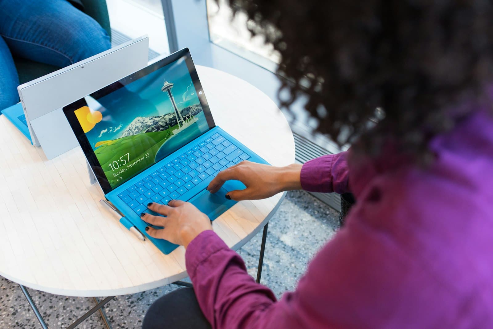 An entrepreneur working on a tablet with a keyboard